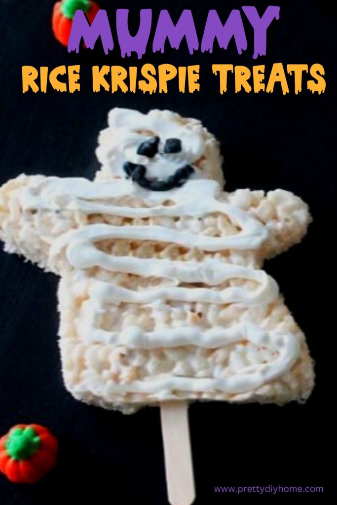 A large mummy rice krispie treat for Halloween on a stick.