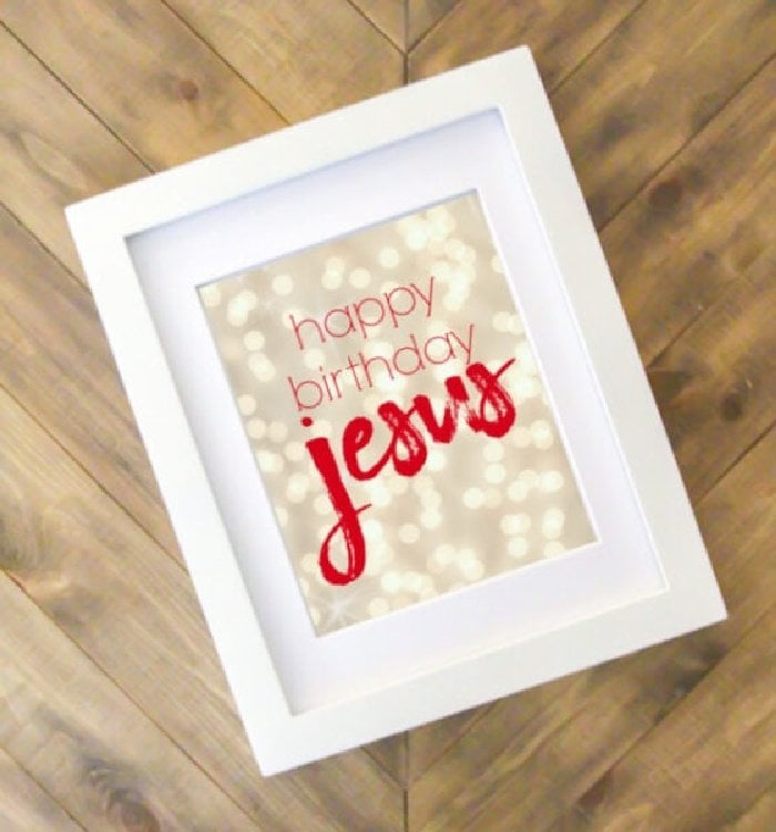 A minimalistic happy birthday jesus Christmas printable. The background is white lights with red lettering.