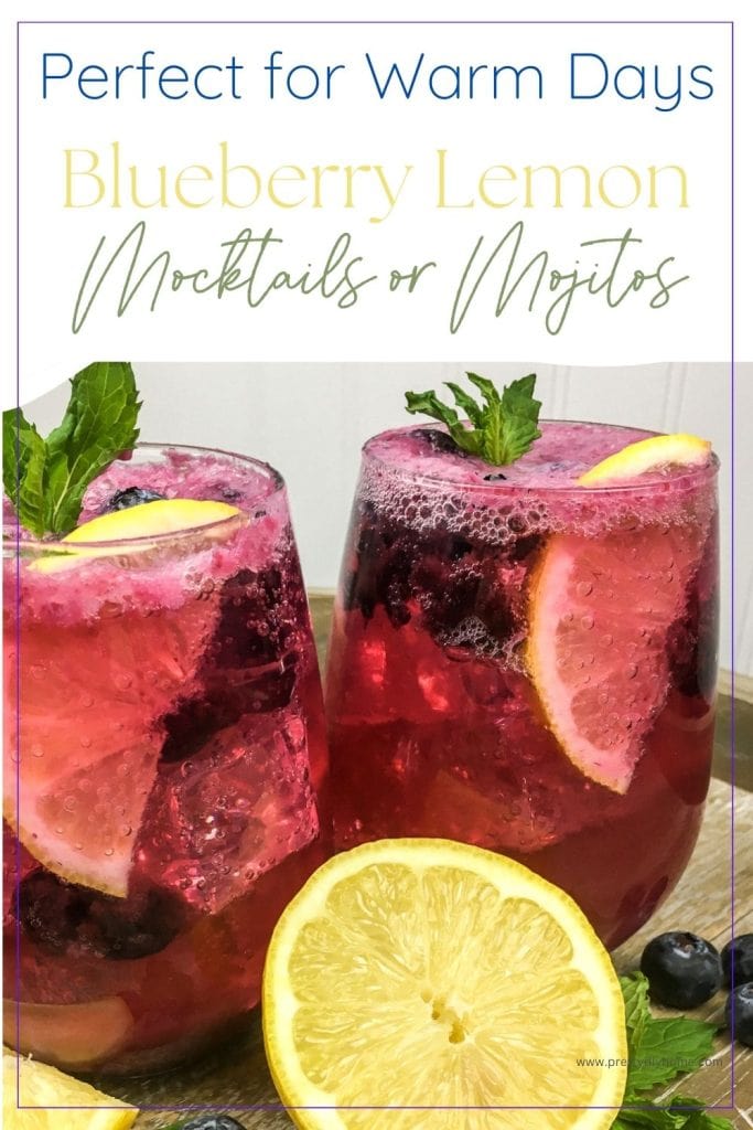 Two glasses of a blueberry lemonade recipe garnished with mint, fresh lemons, fresh blueberries and ice cubes.