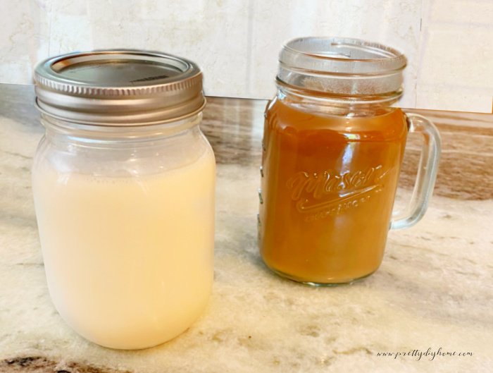 A mason jar filled with homemade pumpkin creamer for coffee.