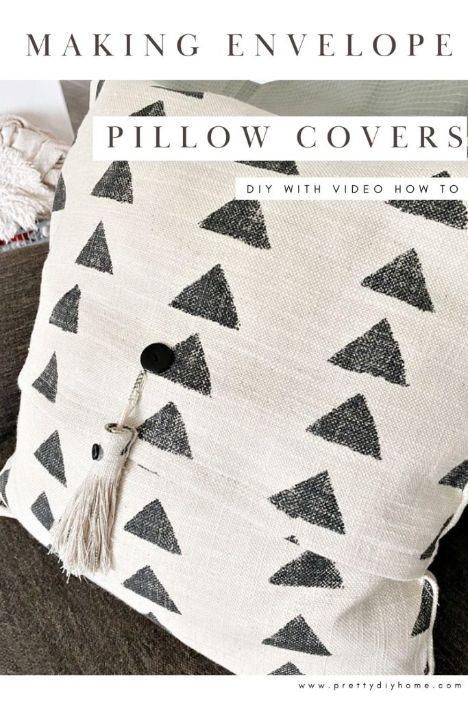 A closeup of a DIY pillow cover. The pillow cover is made with white fabric and black triangles.