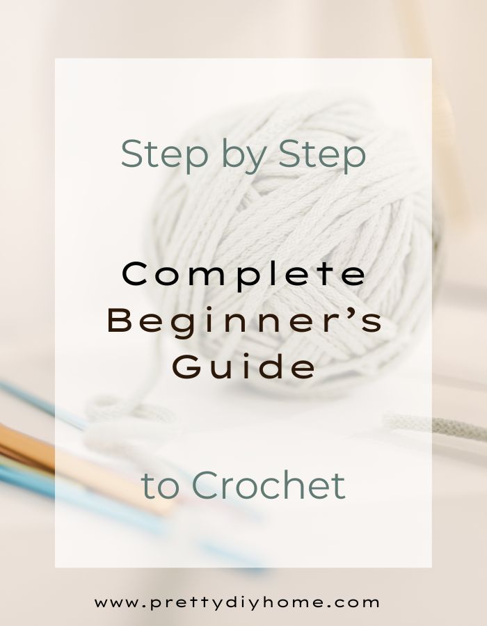 A ball of wool with a crochet hook background. The overlay says Step by Step Complete Beginner's Guide to Crochet