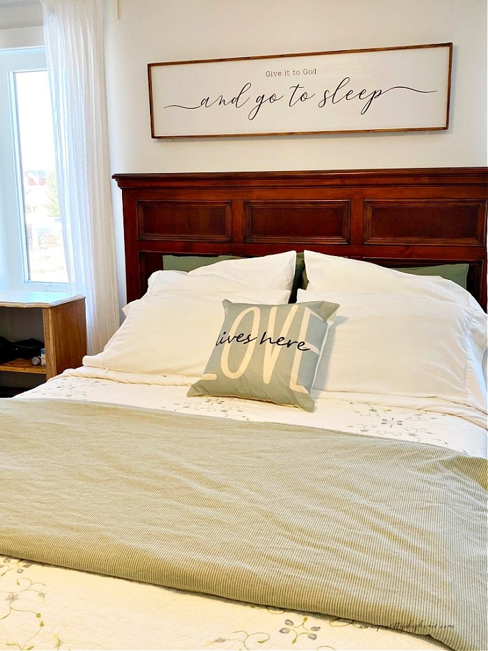 The easiest way to put on a duvet cover showing a freshly place cover over a duvet on a bed.