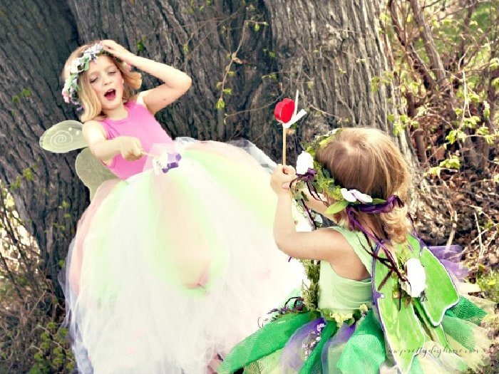 Two little girls playing in their beautiful no sew tutus made with tulle and elastic headbands.