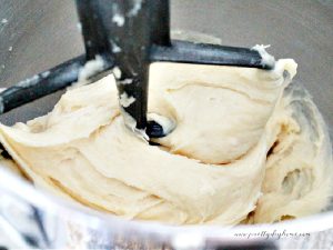 The smooth dough stage of choux pastry being mixed.