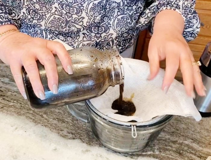 Filter steeped cold brew coffee concentrate through a filter to remove the coffee grounds.