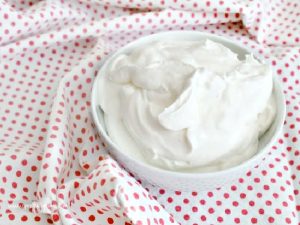 A bowl filled with sweet whipped cream.