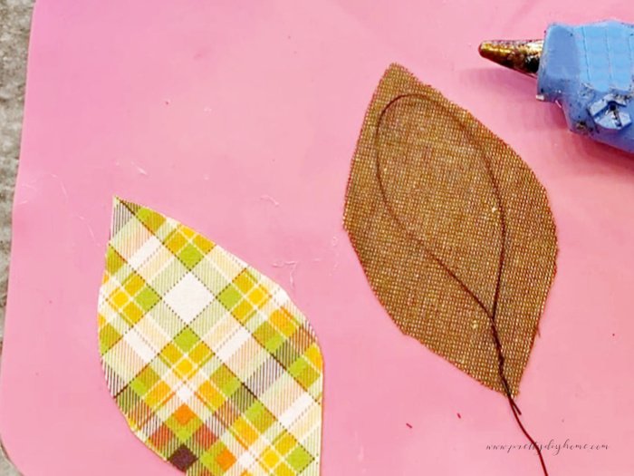 Two fabric leaf cutouts, with a bend florist wire loops in the middle.