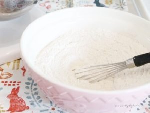 Mixing together the dry ingredients for soft and chewy pumpkin cookies.