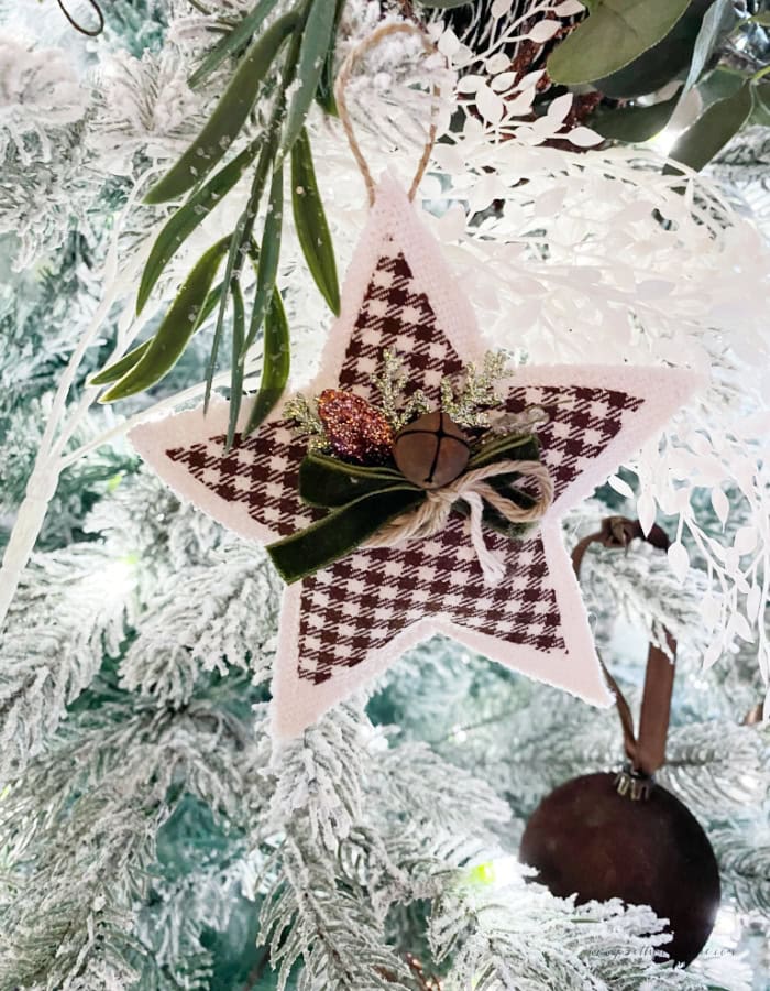 A fabric Christmas star Christmas tree ornament in neutral colors. An easy to make Christmas fabric craft.