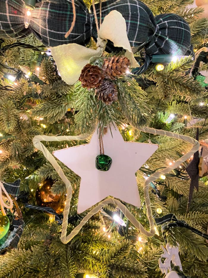 A large wire Christmas Star Christmas tree ornament.