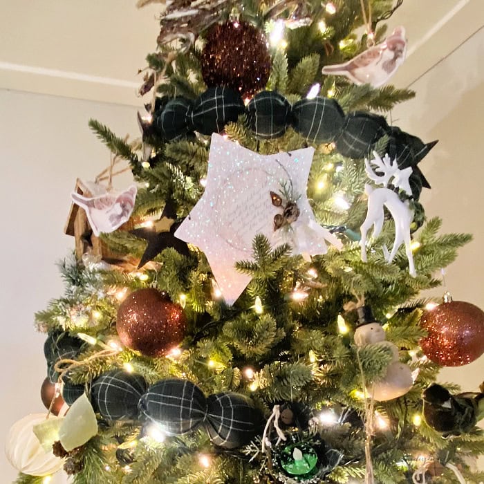 Finished green plaid Christmas garland hanging on a Christmas tree.