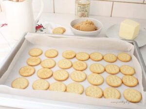Lining a baking sheet with Ritz crackers for Christmas toffee