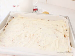 Spreading melted white chocolate over Ritz cracker toffee