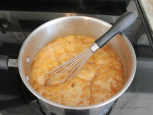 Butter and brown sugar mixture bubbling to make toffee