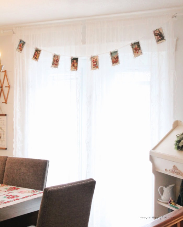 Full length view of the finished vintage Santa banner hanging in the dining room.