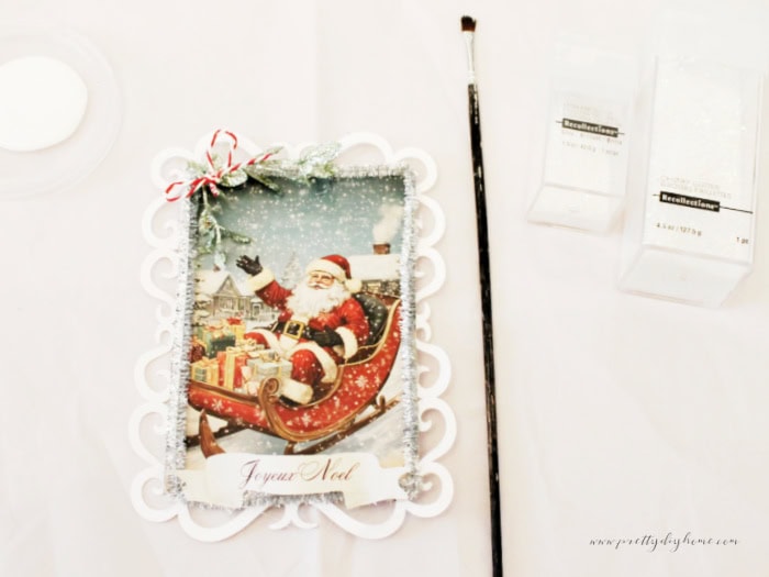 Finish vintage santa panel before applying mod podge and glitter.
