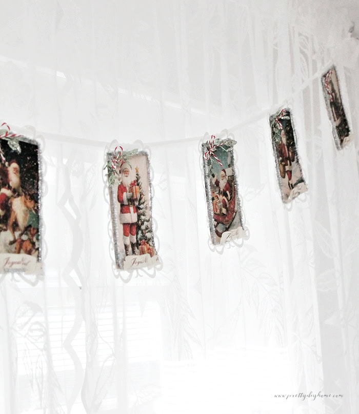 Close up of the right side of the vintage Santa banner showing five postcard panels.