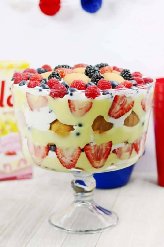 Patriotic berry trifle layered with strawberries, blueberries, pudding, and whipped topping