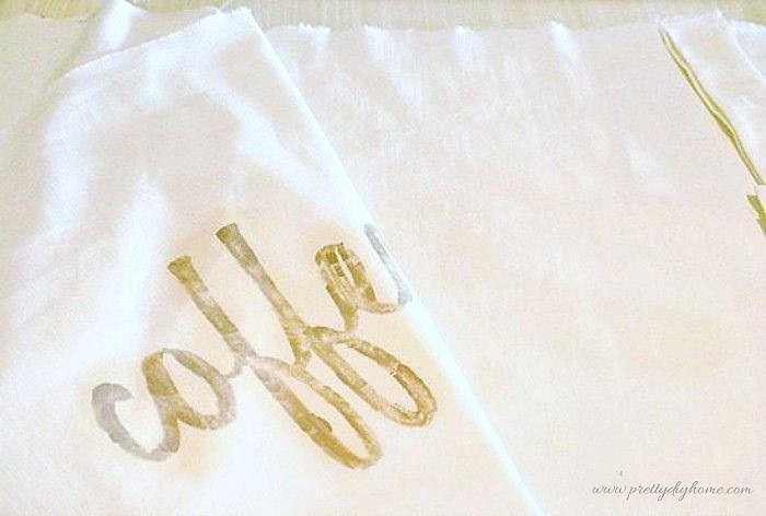 Sewing a DIY bench cushion cover with fabric placed right sides together before stitching.