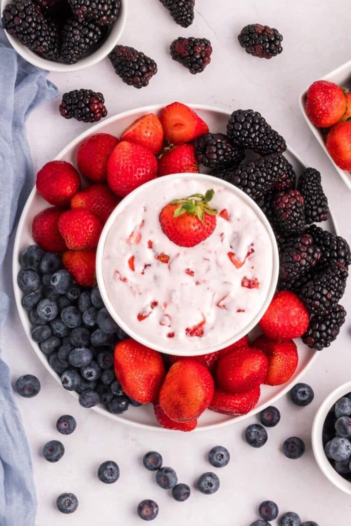 Easy cream cheese fruit dip served with fresh strawberries, blueberries, and blackberries