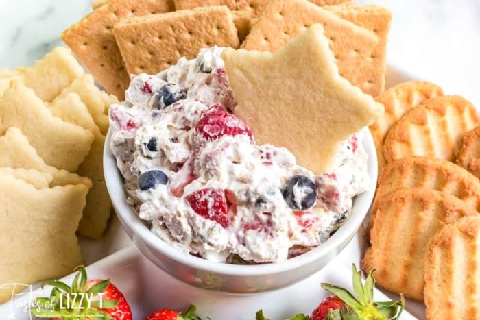 Triple berry fruit dip served with cookies and pie crust dippers