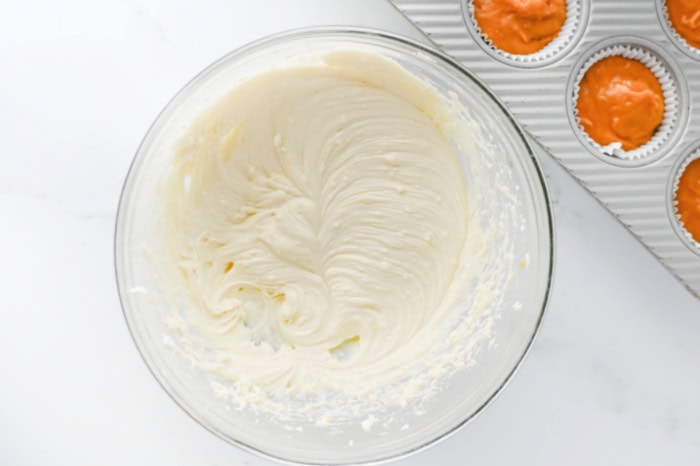 Cream cheese filling mixed until smooth for pumpkin cheesecake muffins.