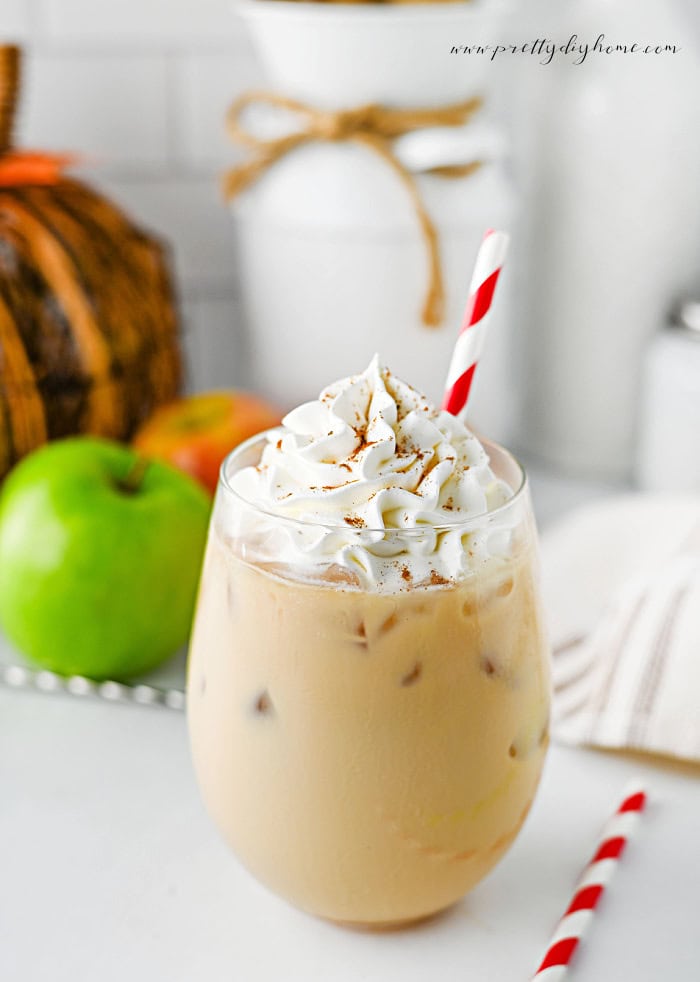 Easy caramel apple latte topped with whipped cream and cinnamon.