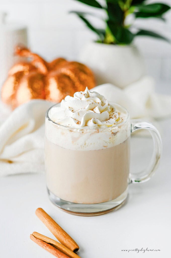 Homemade pumpkin chai latte topped with whipped cream and pumpkin pie spice.