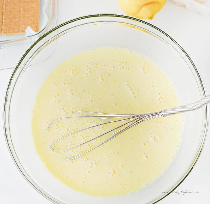 Mixing lemon pudding filling for lemon icebox cake