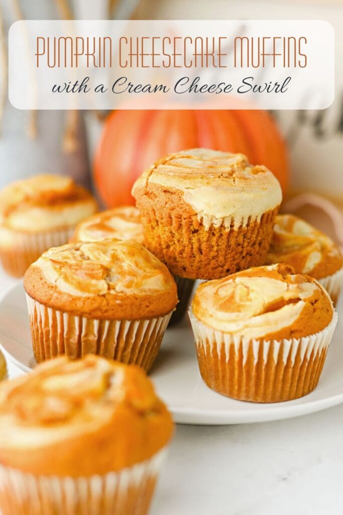 A stack of pumpkin cheesecake muffins with a cream cheese swirl. The Pinterest graphic states pumpkin cheesecake muffin with cream cheese swirl.
