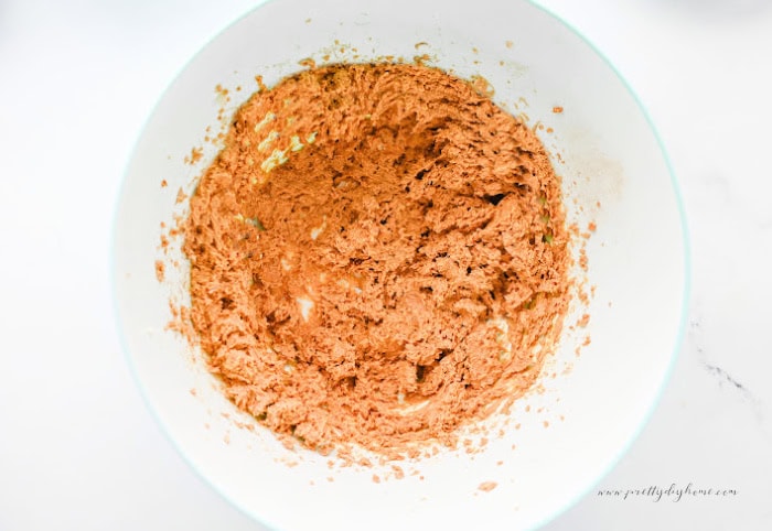 A creamy pumpkin truffle filling mixed until smooth and ready to roll into bite sized truffles.