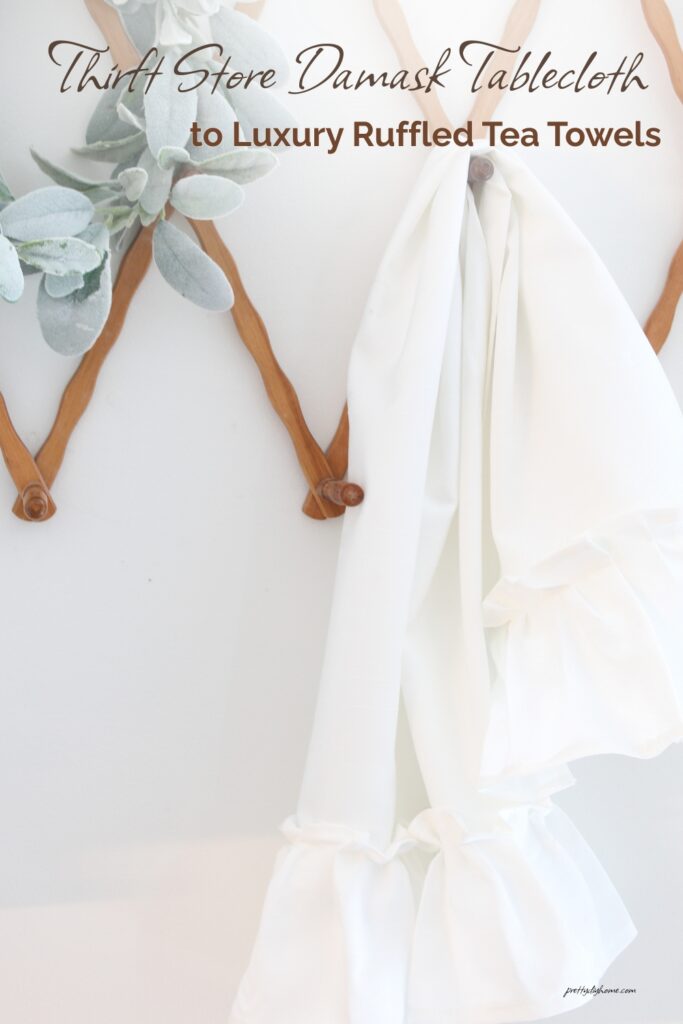A white damask diy tea towel with beautiful handmade ruffles.