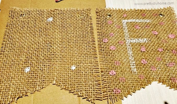 Burlap fall banner panels showing painted white lettering and pink dots.