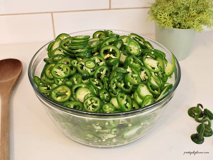 Jalapenos sliced into 1/4 inch rings for homemade cowboy candy.