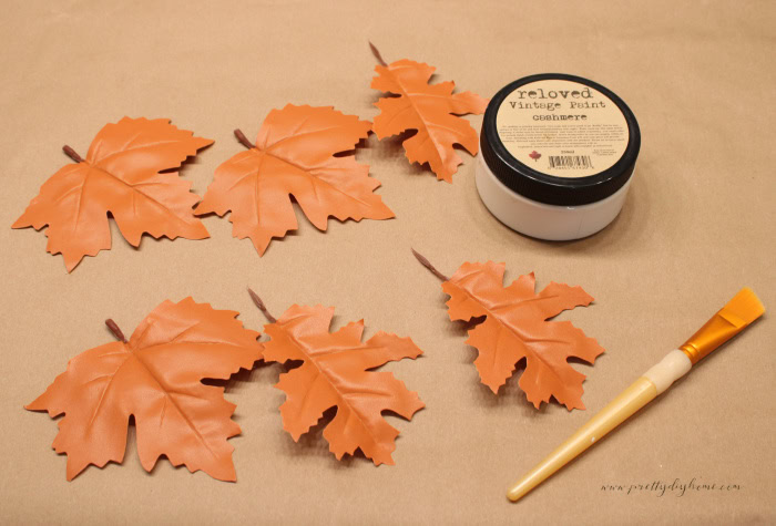Painting faux fall leaves cream for neutral wood tray decor.