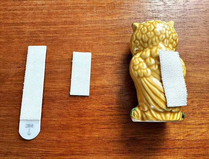 Velcro Command strips cut and attached to a vintage owl salt shaker for fall tray decor.