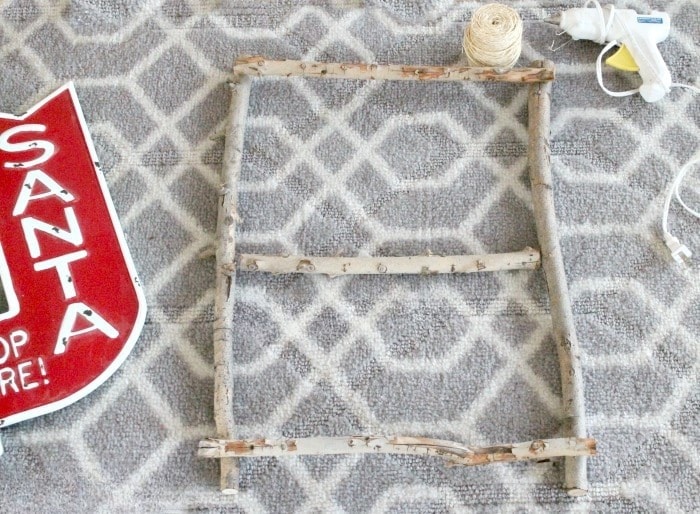 Rectangular birch twig wreath frame with a center support branch.